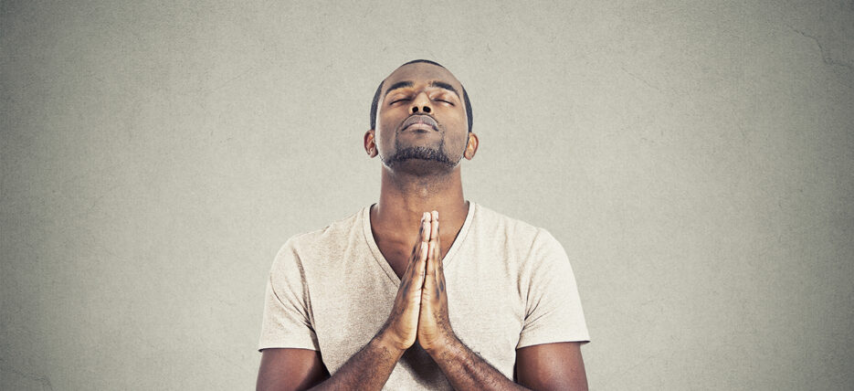 Man praying {{brizy_dc_image_alt entityId=