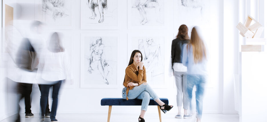Woman on bench in gallery {{brizy_dc_image_alt entityId=